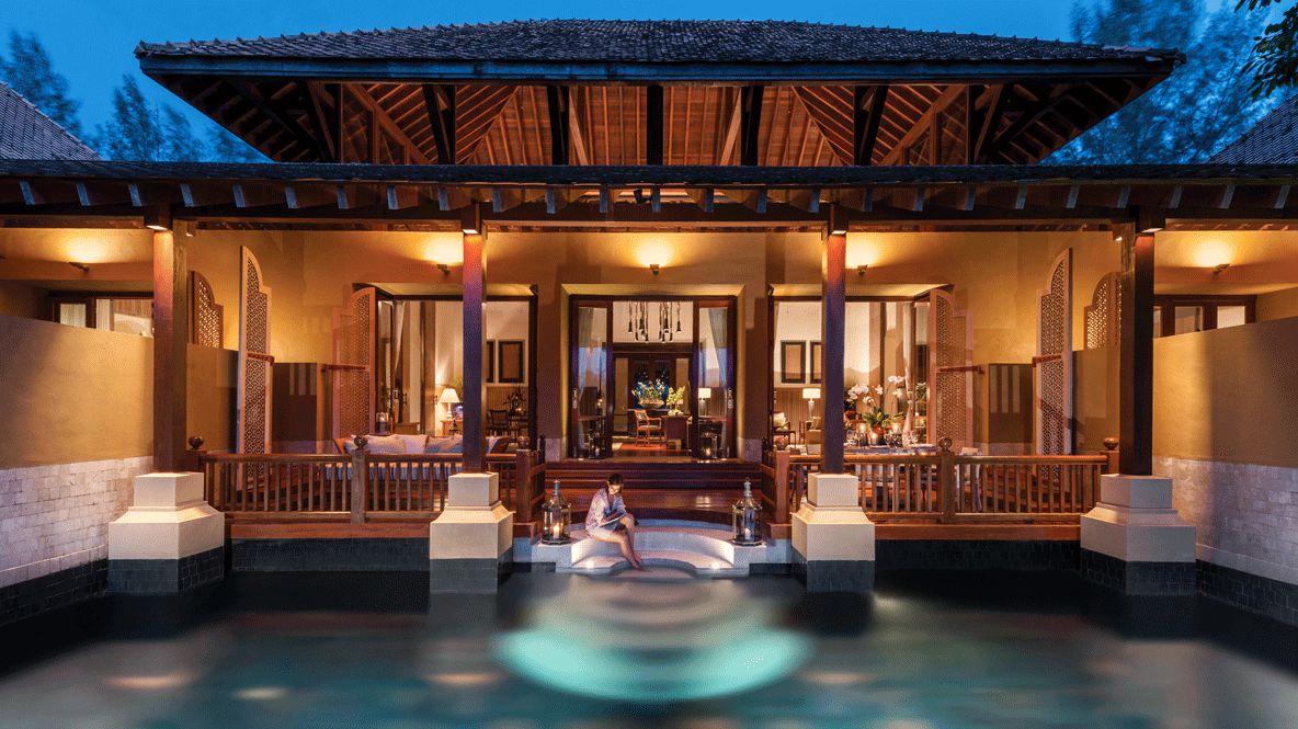 hotels in heaven four seasons langkawi pool outdoor woman relaxing water nighttime lights house terrace