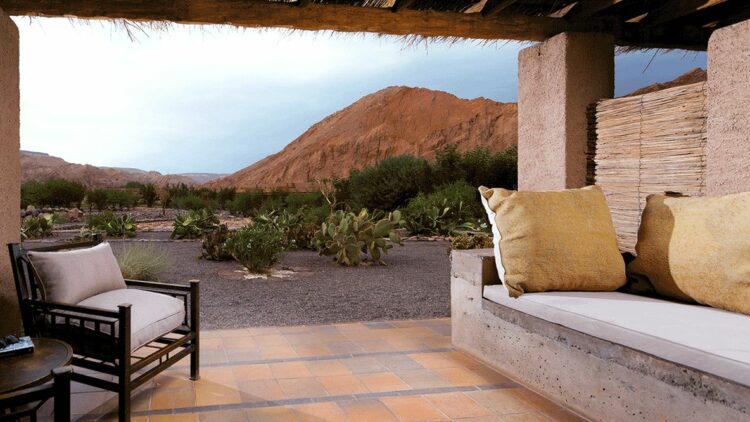 hotels in heaven alto atacama view location terrasse sofa white cushions mountains bushes cactus armchair pillows