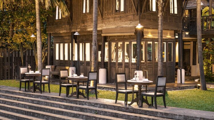 hotels in heaven the siam culinary restaurant open air palm tree napkin flower plate chair table outside meadow stair