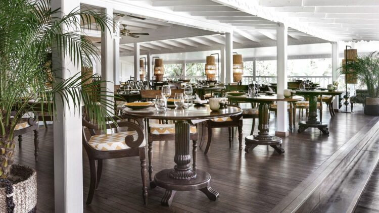 hotels in heaven villa marie saint barth restaurant culinary noble wood furniture wine glass plate plants chair table dinner luxury