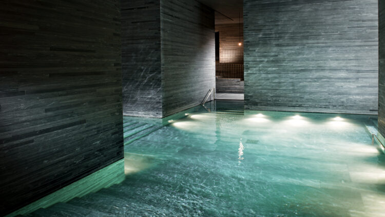 hotels in heaven 7132 spa pools water turquoise relaxing calm dark few lights stone walls darker stairs