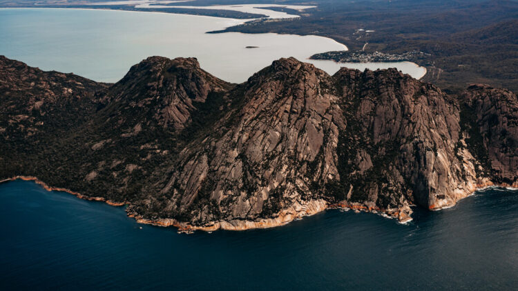 hotels in heaven saffire freycinet location australia outback rocky rocks hills ocean water overview trees boats