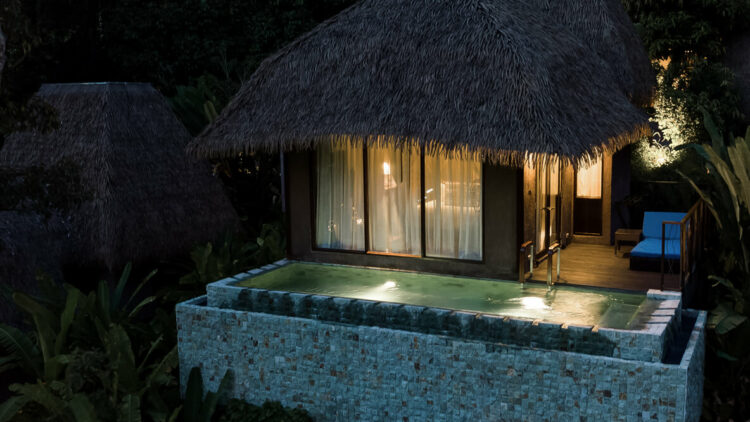 hotels in heaven keemala accommodation outdoor private pool night time dark lights comfy beautiful shack water windows